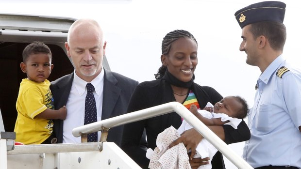 Mariam Yahya Ibrahim arrives at a military airfield outside Rome with her daughter Maya in her arms  and son Martin accompanied by Italian deputy Foreign Minister Lapo Pistelli.