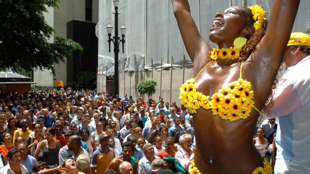 A Brazilian samba dancer performs a public show in downtown Sao Paulo to mark Carnaval. 