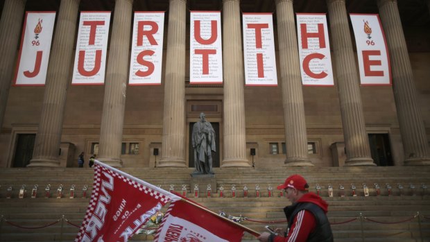 A banner reading Truth and Justice is hung from the Doric pillars of Saint George's Hall in the centre of Liverpool.