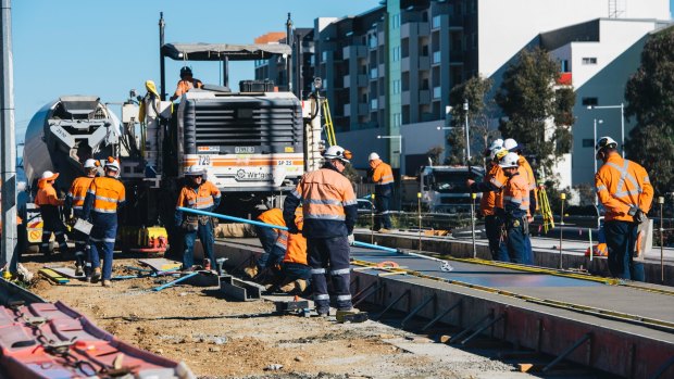 Construction workers have begun work on the light rail concrete slab on Flemington Road.