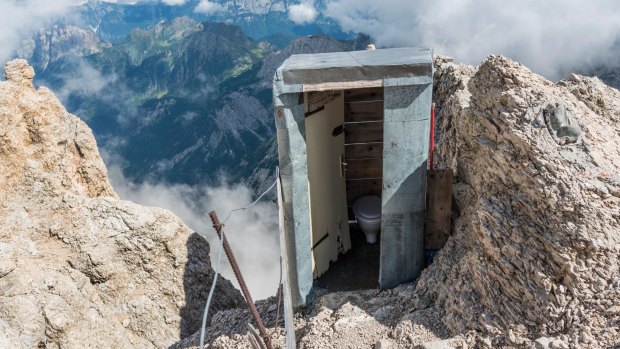 An outdoor toilet on the highest peak of the Dolomites, Italy.