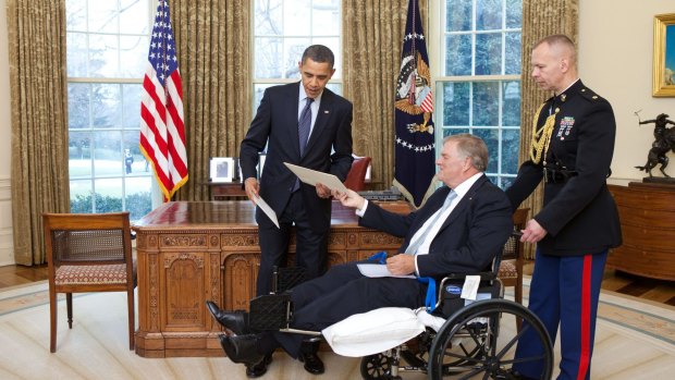President Barack Obama exchanges credentials with Kim Beazley, the incoming ambassador from Australia, in the Oval Office in 2010.