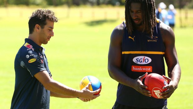 Formula One ace Daniel Ricciardo and ruckman Nic Naitanui in earnest discussion during West Coast Eagles training on Wednesday.