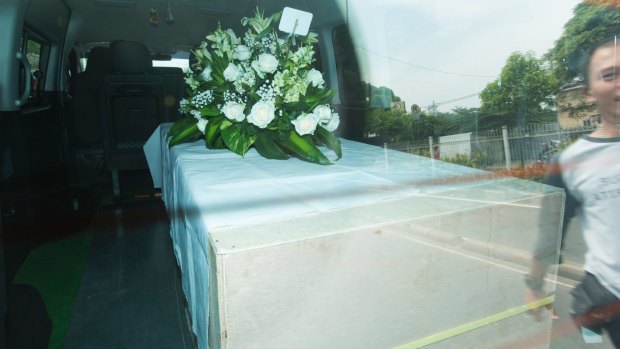 Andrew Chan's coffin leaves a funeral home in Jakarta.