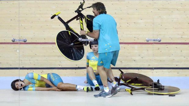 Horror start: Mel Hoskins cries out in pain after a training crash at the Rio velodrome.