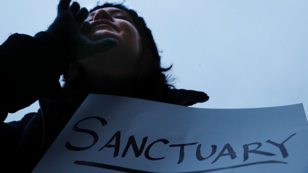 Demonstrators chant against US President Donald Trump's executive order  on "sanctuary cities" in Cincinnati in January. 