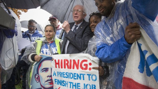 Democratic presidential candidate Senator Bernie Sanders joins low-wage workers, at the Capitol Hill, Washington on Tuesday. 