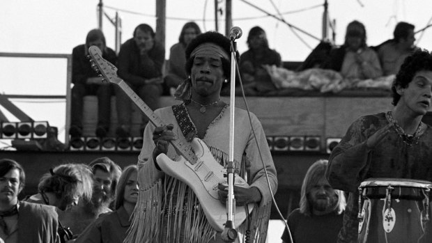 Jimi Hendrix performing his legendary two-hour set at Woodstock in Bethal, New York on August 18, 1969.
