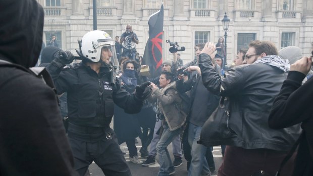 Protesters and police at the gates of Downing Street on Saturday.