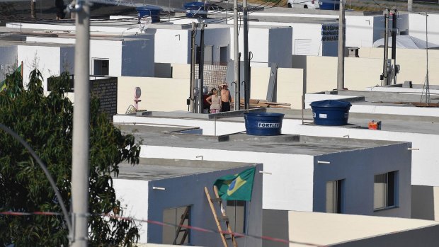 Two rows of new identical houses is all that is left of Vila Autodromo next to the media centre at Rio's Olympic Park.