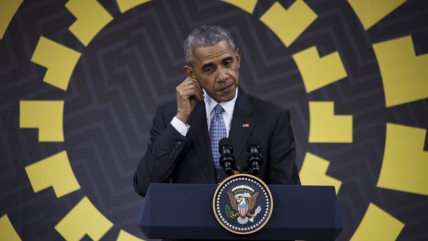 US President Barack Obama pauses during a news conference at the APEC summit in Lima, Peru.