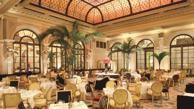Afternoon tea is served in the The Palm Court at The Plaza Hotel, New York.