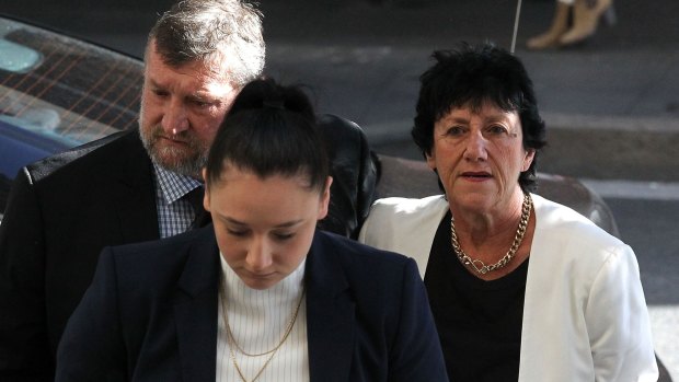 Greg, Virginia and Megan Hughes arrive at the inquest into the death of cricketer Phillip Hughes at the NSW Coroner's Court.