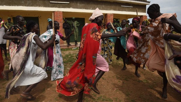 Rival camps: Women supporters of South Sudan's opposition dance on the outskirts of the capital Juba after opposition military chief Simon Gatwech Dual's arrived in the city in April 2016. 