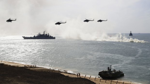 Russian navy ships and helicopters take part in a landing operation during military drills at the Black Sea coast, Crimea, in September.