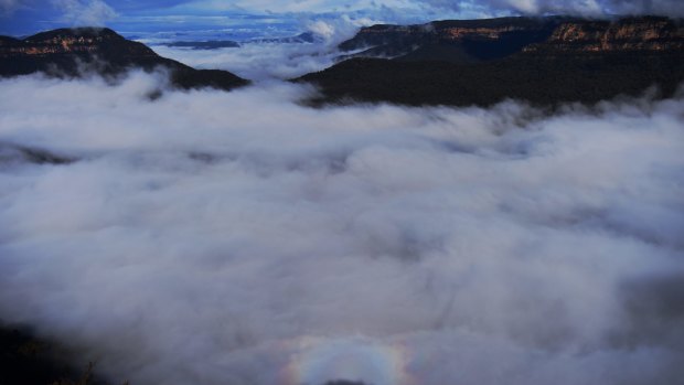 A rainbow is formed in low-lying cloud off Echo Point in the Blue Mountains on Tuesday.