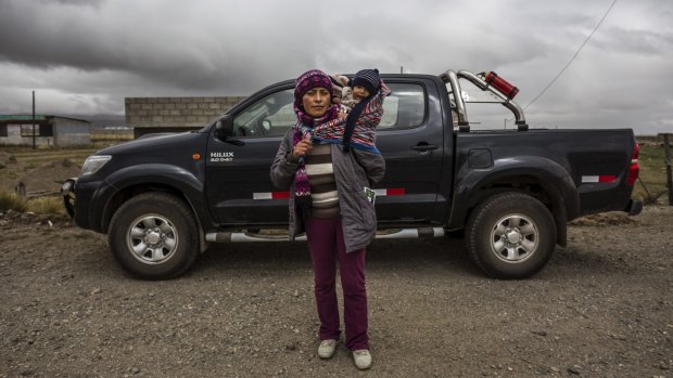 "It has changed my life": Pilar Condor with her son Kenny and her new ute.