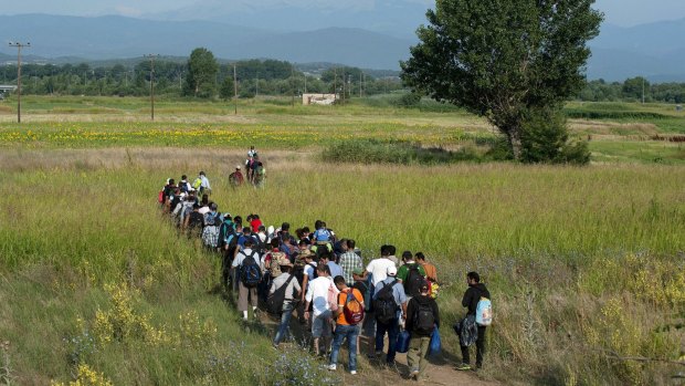 Syrian refugees trudging towards Athens this week. 