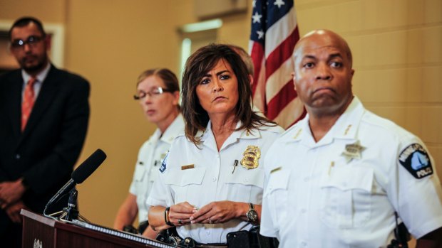 Minneapolis police chief Janee Harteau, centre, answers questions at Thursday's news conference in Minneapolis.