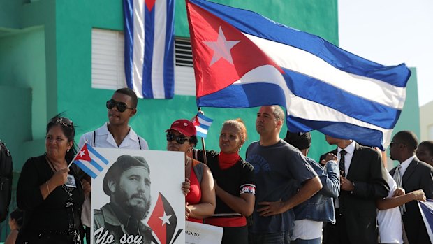 People wait outside the cemetery to see where the remains of former Cuban president Fidel Castro are entombed.