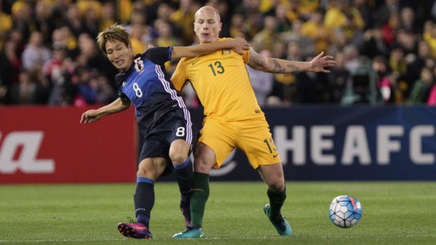 Aaron Mooy of Australia and Genki Haraguchi of Japan contests possession during last year's World Cup qualifier game  at Etihad Stadium.