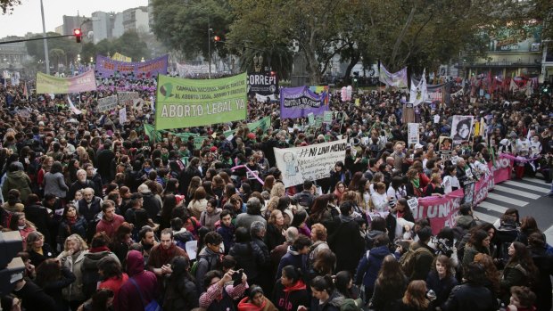 Thousands of demonstrators march against domestic violence outside the National Congress in Buenos Aires, Argentina, last week.