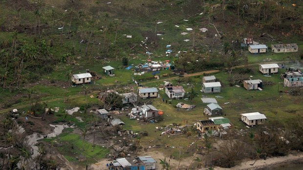 Debris scattered around damaged buildings at Nakama settlement in Fiji after Cyclone Winston.