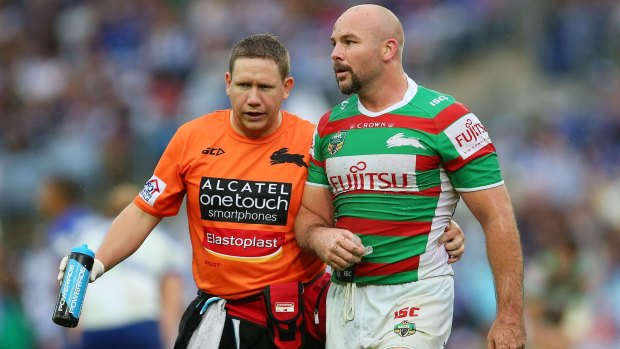 Injury-disrupted season: Glenn Stewart is assisted from the field during the round five match against Canterbury.