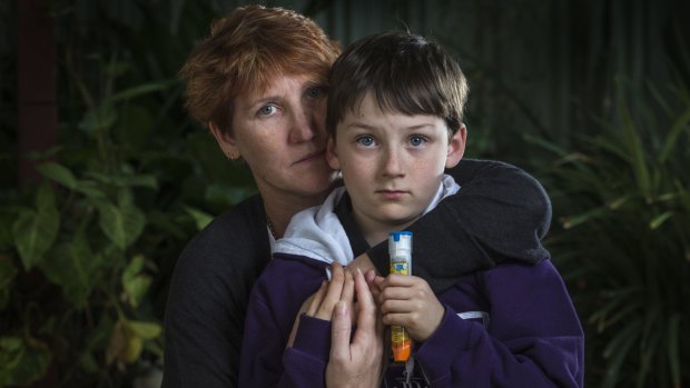 Dee Henderson with her son Aiden (9) who had a severe reaction after three sips of a coconut drink which contained cow's milk. 
