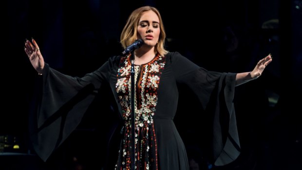 Adele singing and swearing at the 2016 Glastonbury Festival.