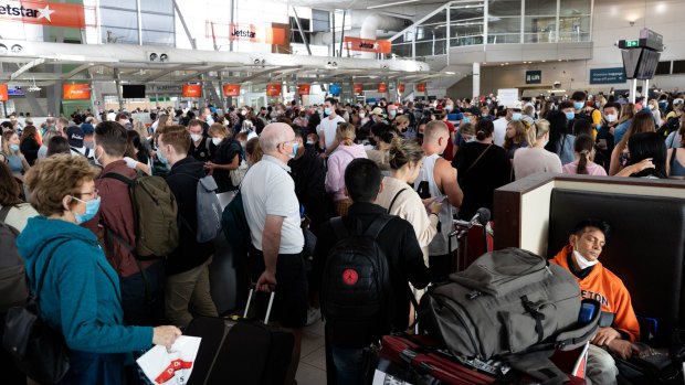Crowds queue at Sydney Airport at the start of the April school holidays.
