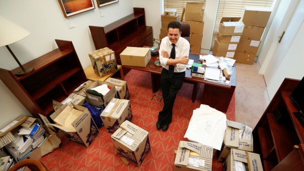 Senator Nick Xenophon with the packing boxes in his office.