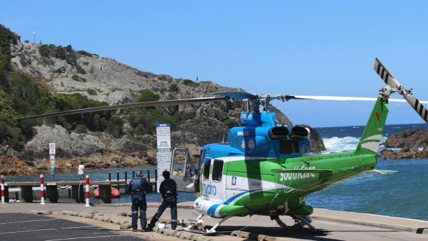 Emergency crews were called to Tathra after a group of Canberra fishermen were swept off the rocks.
