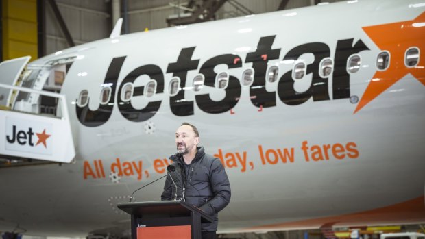 Jetstar chief executive Gareth Evans speaks at the arrival event.