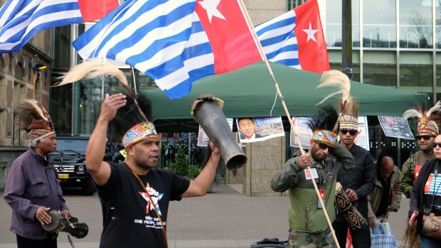 Pro-independence activists protest outside the Dutch parliament in The Hague last month. The demonstration coincided with a visit by Indonesian President Joko Widodo. 