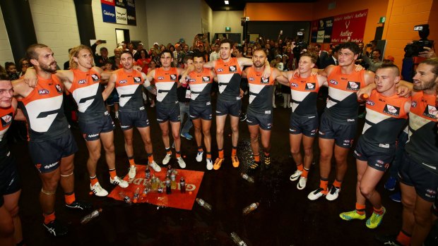 United: The Giants sing the club song after the emphatic win over the Suns.