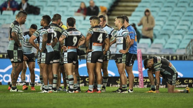 Downcast: The Sharks after their loss to the Rabbitohs on Monday night.