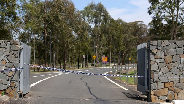Police cordon off the entrance to Lizard Log Park, Wetherill Park following the shooting.