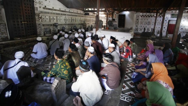 Pilgrims pray at the tomb of Sunan Gunungjati.