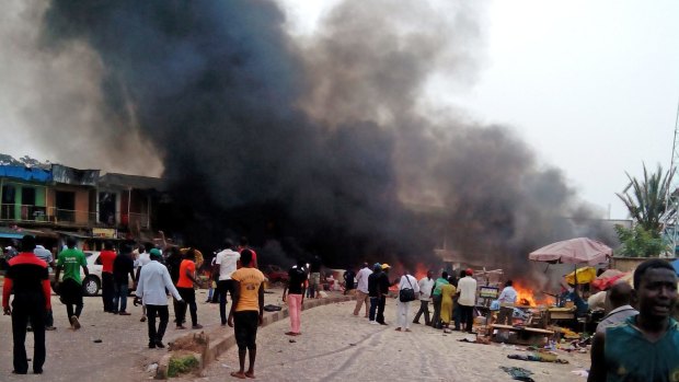 Smoke rises after a bomb blast at a bus terminal in Jos, Nigeria, in May 2014. 