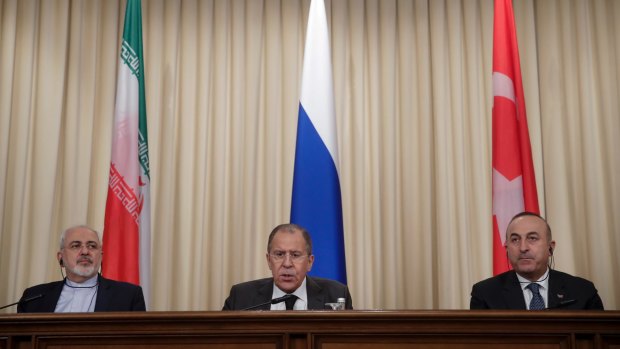 New order: Iranian Foreign Minister Mohammad Javad Zarif, left, Russian Foreign Minister Sergei Lavrov, centre, and Turkish Foreign Minister Mevlut Cavusoglu in Moscow on December 20.