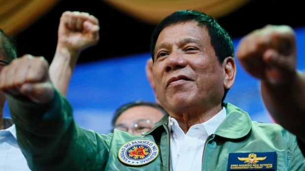 Philippine President Rodrigo Duterte does this trademark fist bump.