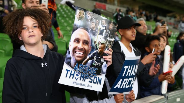 Fans show their support for Thompson.