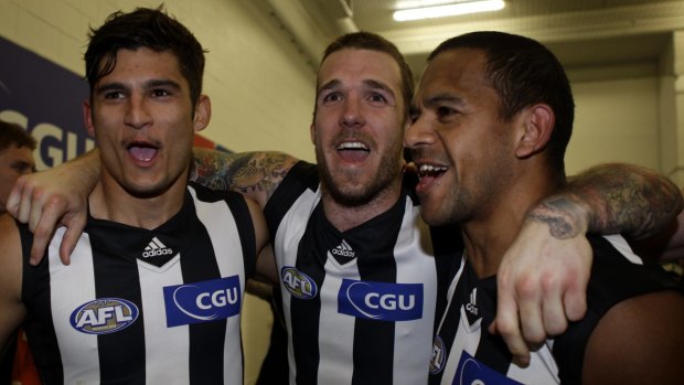 Sharrod Wellingham with Dane Swan and Leon Davis after defeating Hawthorn in the preliminary final in 2011.