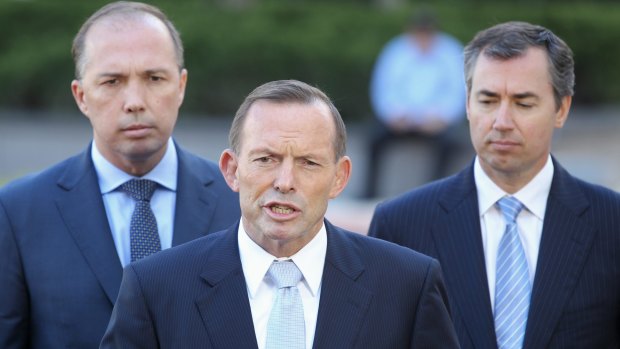 Prime Minister Tony Abbott, flanked by Immigration Minister Peter Dutton and Justice Minister Michael Keenan on Wednesday. 