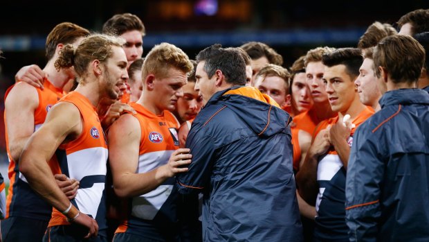Tough call: Giants head coach Leon Cameron speaks to his players during the round 12 match against North Melbourne.