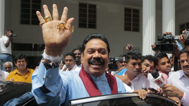 Former Sri Lankan president and parliamentary candidate Mahinda Rajapaksa leaves his party head office in Colombo on Wednesday.