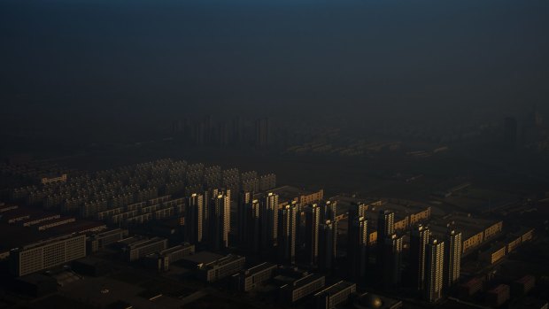 "Haze in China" by photographer Zhang Lei won first prize in the 'Contemporary Issues Singles' category. It shows a city in northern China shrouded in haze.