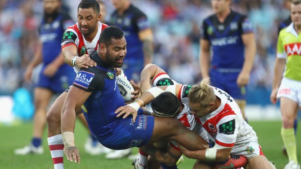 Wrapped up: Tony Williams is tackled during the round 14 NRL match between the St George Illawarra Dragons and the Canterbury Bulldogs at ANZ Stadium.