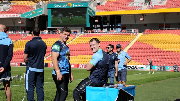 Greg Bird and Paul Gallen at Tuesday's captain's run, with the Suncorp Stadium screen playing highlight's of last year's game three humiliation in the background.